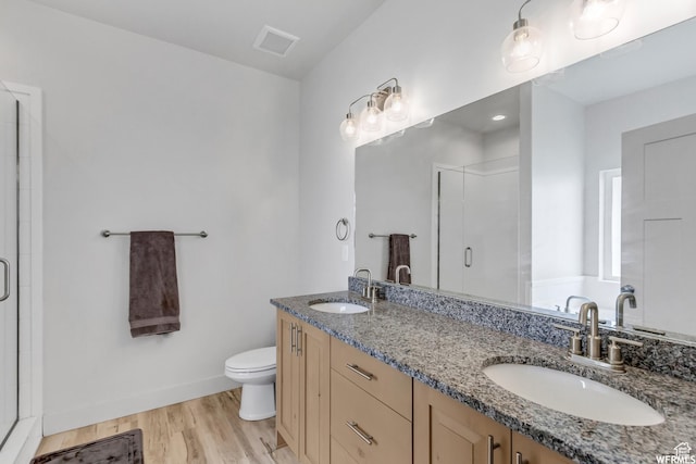 4024 W 2875 N, Plain City, UT 84404 - full bath with a shower stall, toilet, wood finished floors, and double vanity