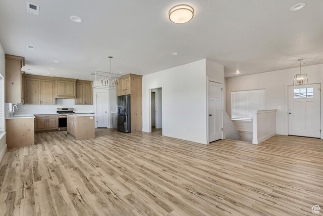 4024 W 2875 N, Plain City, UT 84404 - kitchen featuring stainless steel range oven, black fridge with ice dispenser, open floor plan, light countertops, and light wood-style floors