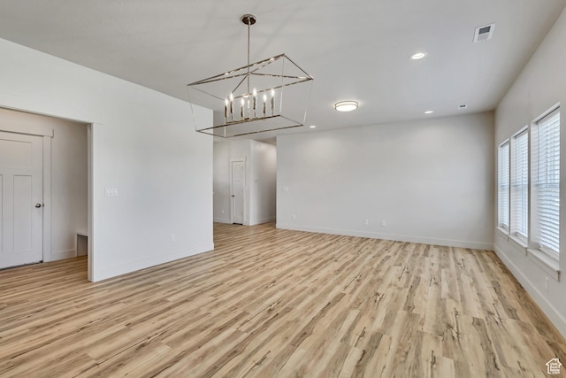 4024 W 2875 N, Plain City, UT 84404 - spare room featuring light wood-style flooring, baseboards, a chandelier, and recessed lighting