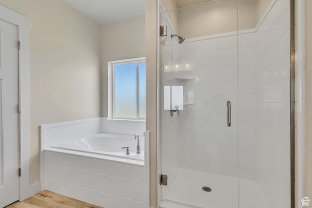 4024 W 2875 N, Plain City, UT 84404 - bathroom featuring a shower stall, a bath, and wood finished floors
