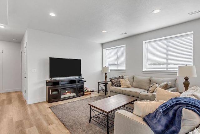 4024 W 2875 N, Plain City, UT 84404 - living room featuring light wood-style floors, recessed lighting, and baseboards