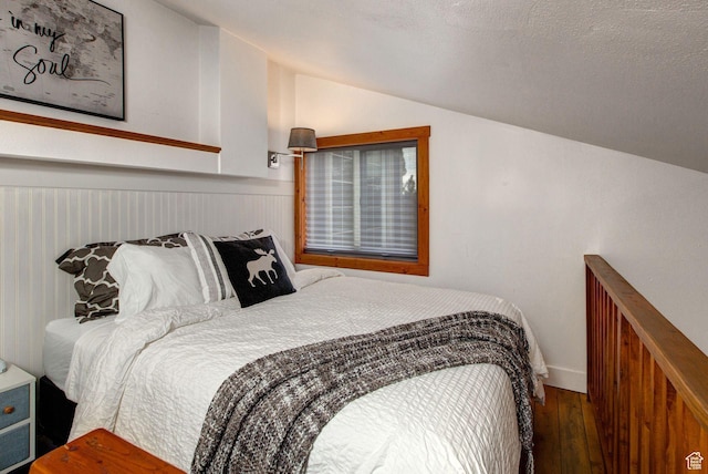 2325 Sidewinder Dr Unit 821, Park City, UT 84060 - bedroom featuring hardwood / wood-style flooring, lofted ceiling, and a textured ceiling