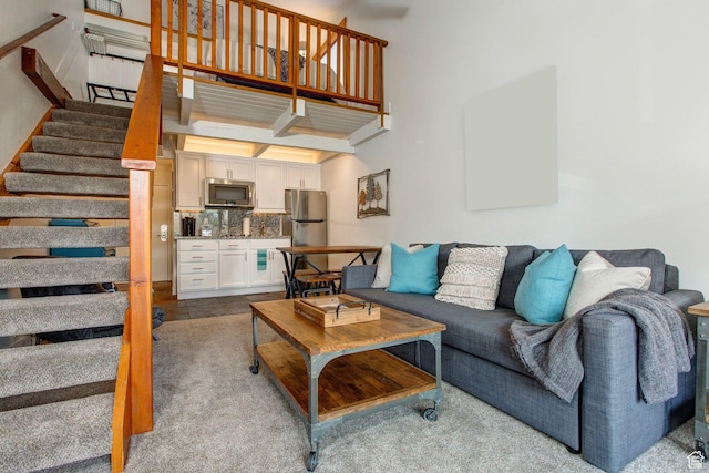 living room with beamed ceiling