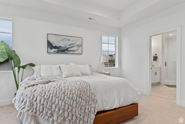 3559 S Garibaldi Way, Saratoga Springs, UT 84045 - bedroom featuring connected bathroom, a raised ceiling, and light carpet