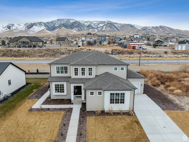 3559 S Garibaldi Way, Saratoga Springs, UT 84045 - view of front of property with cooling unit, a garage, a mountain view, and a front yard