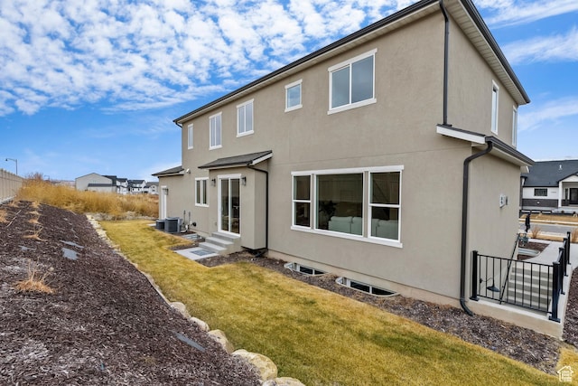 3559 S Garibaldi Way, Saratoga Springs, UT 84045 - back of house with cooling unit and a lawn