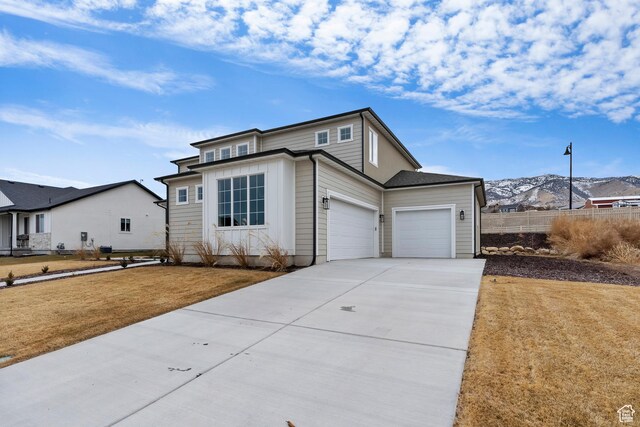 3559 S Garibaldi Way, Saratoga Springs, UT 84045 - view of front facade featuring a garage, a mountain view, and a front yard