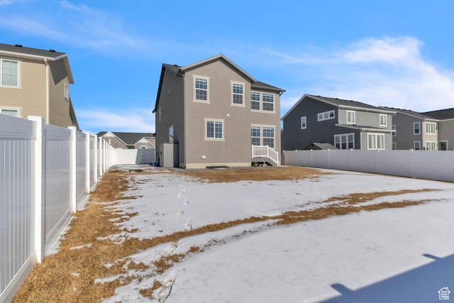 view of snow covered house