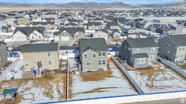 snowy aerial view featuring a mountain view