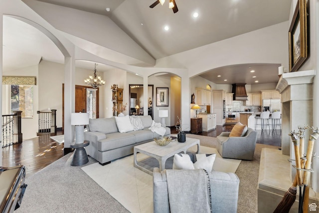 3180 E Stoney Creek Cir S, Heber City, UT 84032 - living room featuring arched walkways, vaulted ceiling, a ceiling fan, recessed lighting, and a chandelier