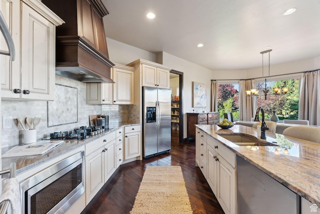 3180 E Stoney Creek Cir S, Heber City, UT 84032 - kitchen with stainless steel appliances, a sink, a chandelier, light stone countertops, and backsplash