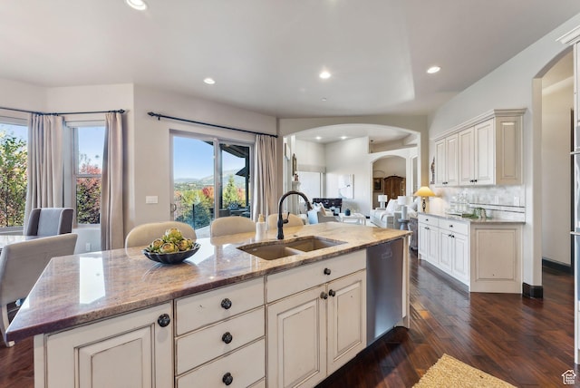 3180 E Stoney Creek Cir S, Heber City, UT 84032 - kitchen featuring a sink, arched walkways, open floor plan, dishwasher, and healthy amount of natural light