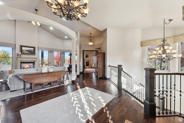 3180 E Stoney Creek Cir S, Heber City, UT 84032 - entryway featuring a chandelier, high vaulted ceiling, arched walkways, hardwood / wood-style flooring, and recessed lighting