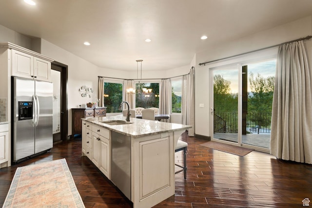 3180 E Stoney Creek Cir S, Heber City, UT 84032 - kitchen featuring stainless steel appliances, a sink, light stone countertops, dark wood-style flooring, and recessed lighting