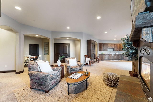 3180 E Stoney Creek Cir S, Heber City, UT 84032 - living area featuring arched walkways, recessed lighting, light carpet, and baseboards