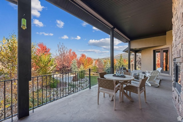 3180 E Stoney Creek Cir S, Heber City, UT 84032 - view of patio / terrace featuring french doors, a balcony, outdoor dining area, and a mountain view