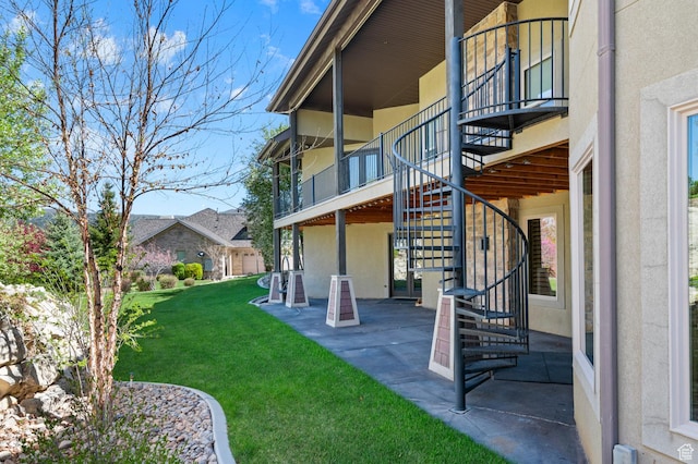 3180 E Stoney Creek Cir S, Heber City, UT 84032 - view of green lawn with stairs, a patio area, and a balcony