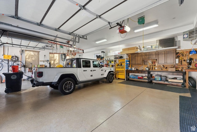 3180 E Stoney Creek Cir S, Heber City, UT 84032 - garage featuring a garage door opener and a workshop area