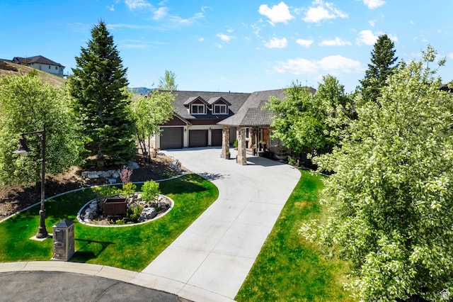 3180 E Stoney Creek Cir S, Heber City, UT 84032 - view of front of home with curved driveway, a front yard, and an attached garage
