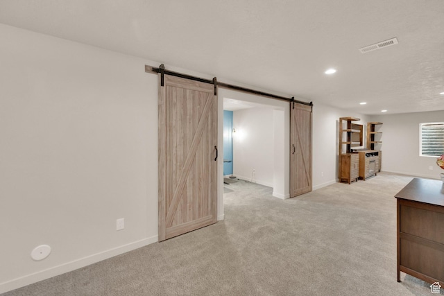 1054 S 1050 W, Tooele, UT 84074 - below grade area with a barn door, recessed lighting, light colored carpet, and baseboards