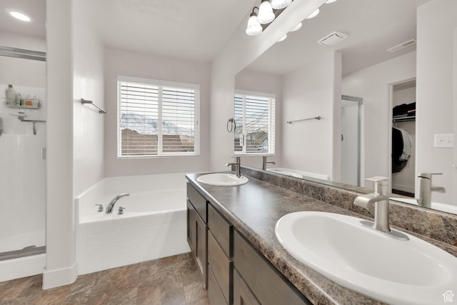 1054 S 1050 W, Tooele, UT 84074 - full bathroom with a stall shower, a garden tub, double vanity, and a walk in closet