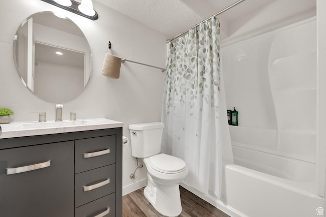 1054 S 1050 W, Tooele, UT 84074 - full bathroom featuring wood finished floors, toilet, shower / bath combo with shower curtain, vanity, and a textured ceiling