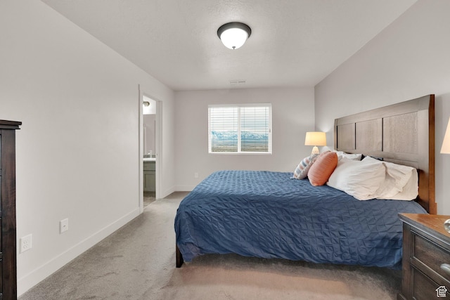 1054 S 1050 W, Tooele, UT 84074 - bedroom with light colored carpet, baseboards, and connected bathroom