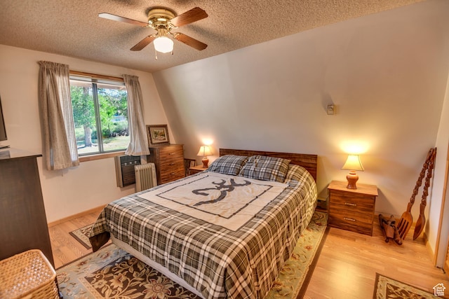 2690 E Hwy 153, Beaver, UT 84713 - bedroom featuring ceiling fan, radiator heating unit, light hardwood / wood-style flooring, and a textured ceiling
