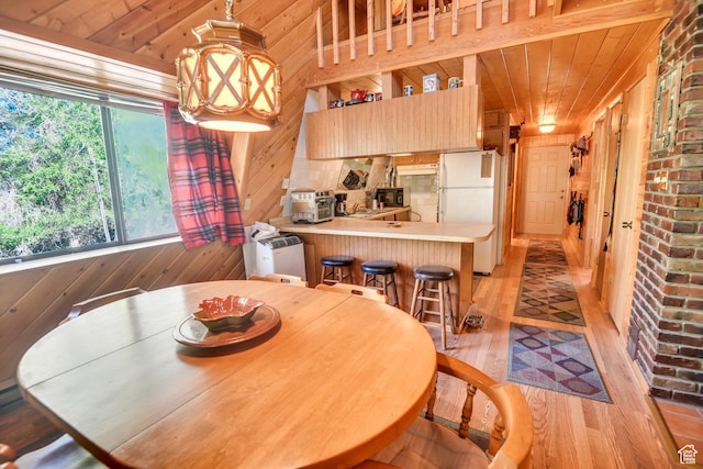 2690 E Hwy 153, Beaver, UT 84713 - dining area with wood ceiling, wooden walls, light hardwood / wood-style floors, and a notable chandelier