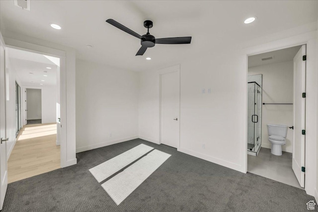 5367 W 3180 S, Hurricane, UT 84737 - unfurnished bedroom featuring ceiling fan, ensuite bath, and dark colored carpet
