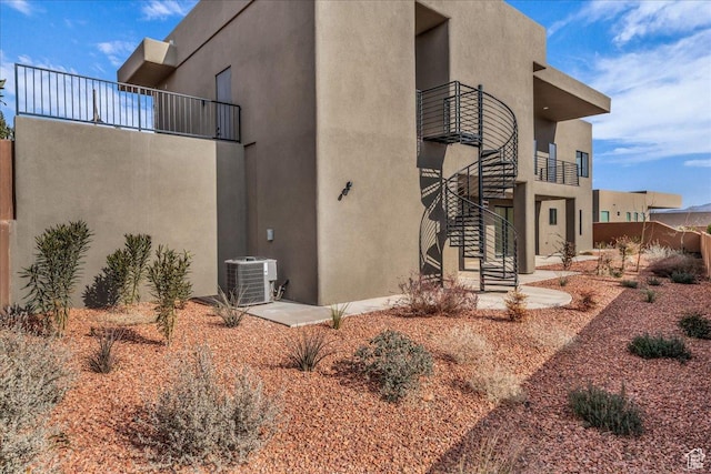 5367 W 3180 S, Hurricane, UT 84737 - view of property exterior with a balcony and central air condition unit