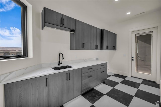 5367 W 3180 S, Hurricane, UT 84737 - kitchen with gray cabinets, sink, and light stone counters