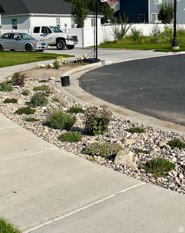 exterior space featuring fence and driveway
