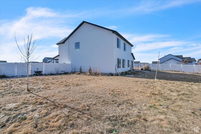 view of property exterior featuring a fenced backyard