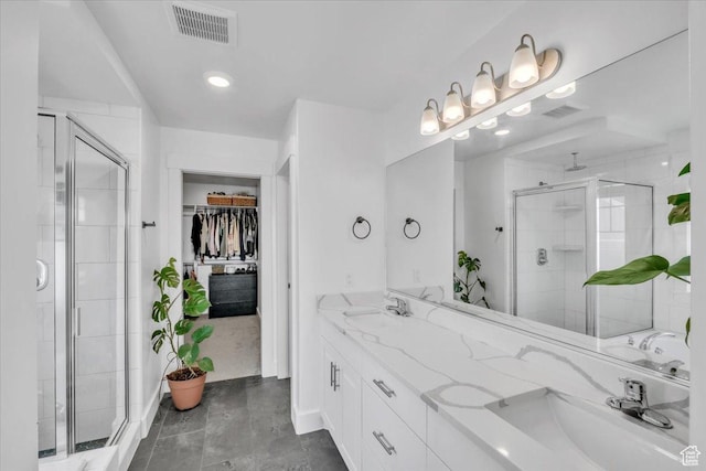 full bathroom featuring a sink, visible vents, and a stall shower