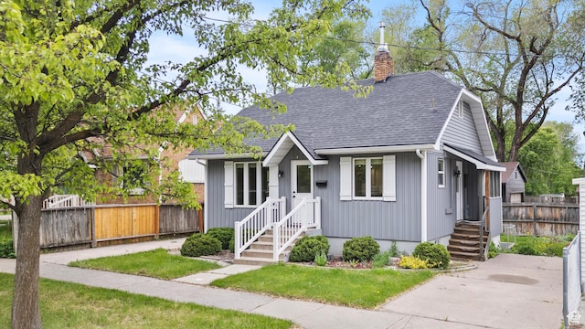 385 N 400 E, Logan, UT 84321 - bungalow featuring a shingled roof and a chimney