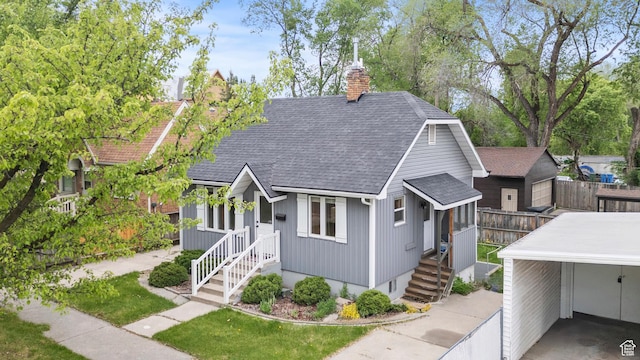 385 N 400 E, Logan, UT 84321 - view of front of property featuring a shingled roof and a chimney