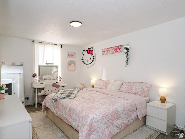 bedroom featuring light colored carpet
