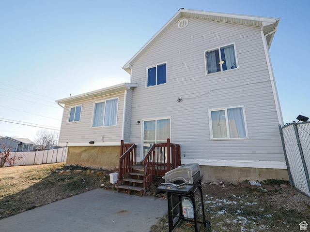 rear view of property featuring a patio area