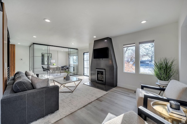 1489 E Spring Ln S, Holladay, UT 84117 - living room with a fireplace and light hardwood / wood-style floors