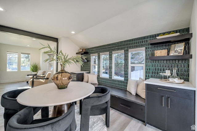1489 E Spring Ln S, Holladay, UT 84117 - dining space featuring vaulted ceiling, plenty of natural light, and light hardwood / wood-style floors