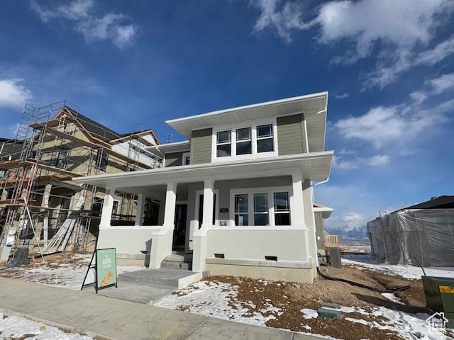 view of front of home with crawl space and covered porch