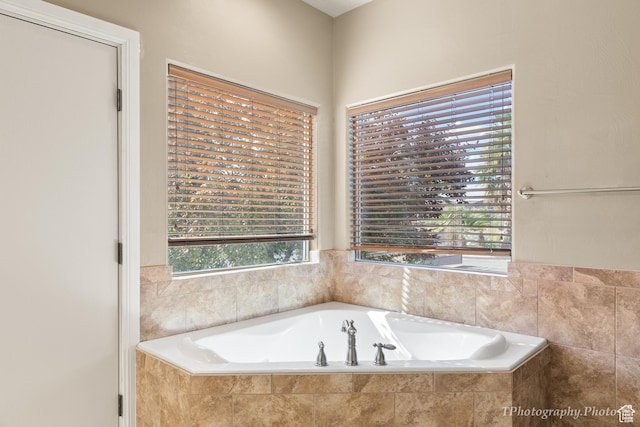 bathroom with tiled bath