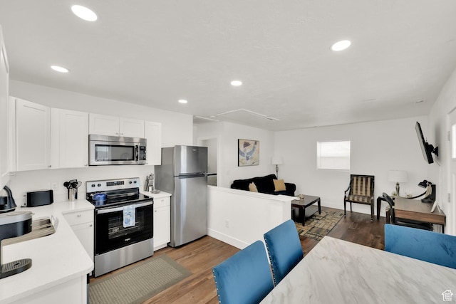 870 E Vics Rd, Sandy, UT 84094 - kitchen with white cabinetry, wood-type flooring, and appliances with stainless steel finishes