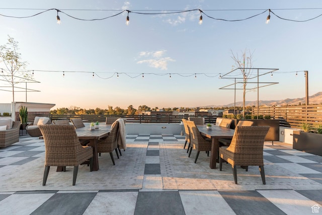 view of patio terrace at dusk