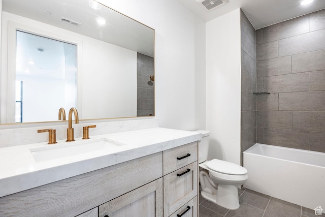 full bathroom with tiled shower / bath combo, vanity, tile patterned flooring, and toilet