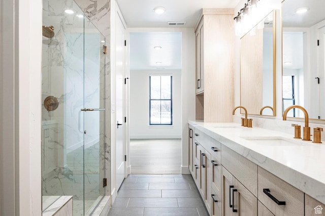 bathroom featuring vanity and walk in shower