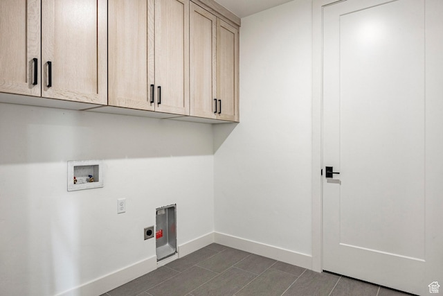 laundry room featuring cabinets, washer hookup, and electric dryer hookup