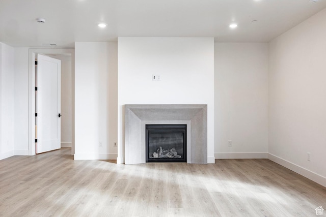 unfurnished living room featuring light hardwood / wood-style floors