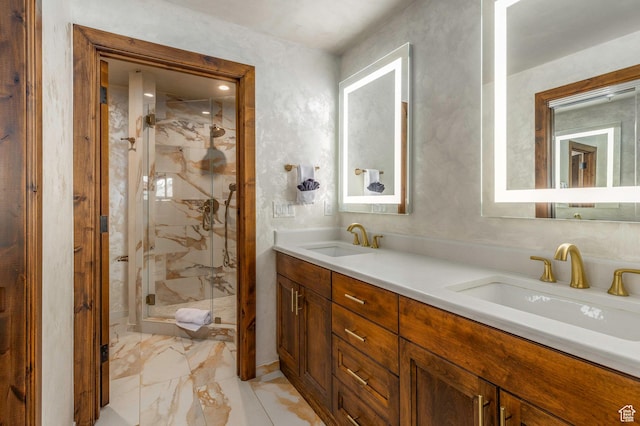 full bathroom featuring a marble finish shower, marble finish floor, a sink, and double vanity